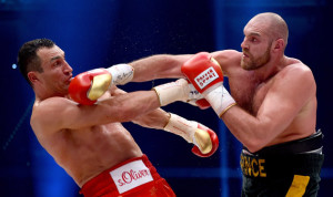 NOVEMBER 28: Tyson Fury in action with Wladimir Klitschko during their IBF/IBO/WBA/WBO World Heavyweight Championship title fight at Esprit-Arena on November 28, 2015 in Duesseldorf, Germany.  (Photo by Lars Baron/Bongarts/Getty Images)