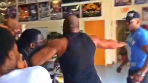 Middle man: Briggs trying desperately to calm Stiverne and Miller down
