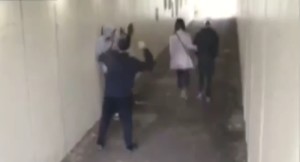 'He who cast the first stone' Thug throws stone at girl. 